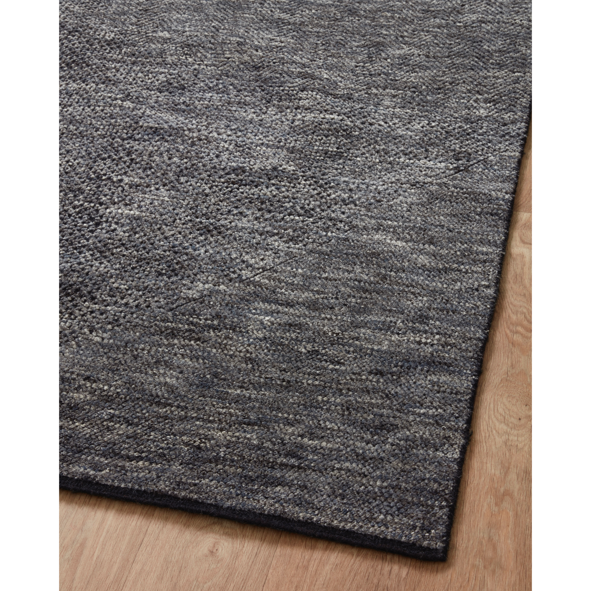The Collins Amber Lewis x Loloi COI-01 AL Charcoal / Denim rug for Amber Lewis x Loloi is hand-knotted of wool and cotton by skilled artisans in India and GoodWeave-Certified. Collins features varying knotting techniques interwoven to create a uniquely texture pattern. Amethyst Home provides interior design, new construction, custom furniture, and rugs for the Park City and Salt Lake City, Utah metro area.