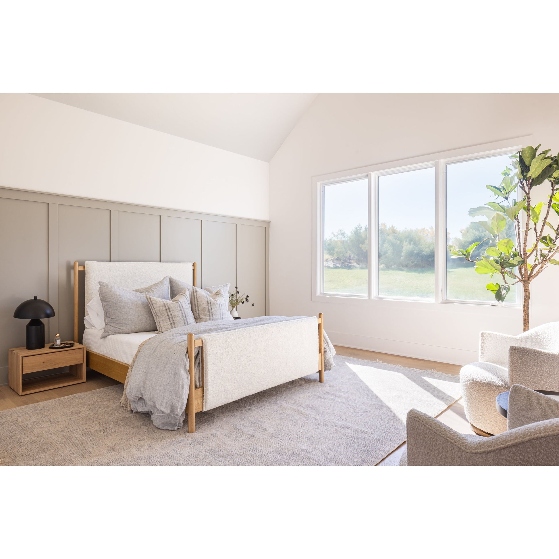 Bring a cozy hygge vibe to the bedroom with this textured Bowen Bed. Framed by light-finished solid oak, a sling-style bed features faux shearling head and foot boards -- sure to elevate any bedroom. Amethyst Home provides interior design, new home construction design consulting, vintage area rugs, and lighting in the Monterey metro area.