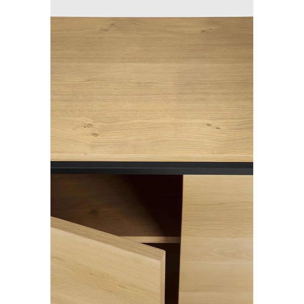 Featuring Monolit Sideboard by Ethnicraft at Amethyst Home. Practicality without sacrificing style. The contrasting characteristics of wood and the rectangular metal frame of the Monolit sideboard create a unique backdrop for all modern media equipment.
Dimensions: 20.5" L x 46" W x 33" H 
Adjustable Shelves : YesAnti-tipping mechanism : YesBrushed : This f. Amethyst Home provides interior design, new home construction design consulting, vintage area rugs, and lighting in the Nashville metro area.