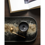 A subdued color palette meets captivating motifs inspired by nature and travel. This Black Organic glass valet tray experiments with the balance between rich patterns offset with muted tones, revealing the beauty behind the deceivingly ordinary subjects from which inspiration is drawn. Amethyst Home provides interior design, new home construction design consulting, vintage area rugs, and lighting in the Boston metro area.