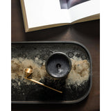 A subdued color palette meets captivating motifs inspired by nature and travel. This Black Organic glass valet tray experiments with the balance between rich patterns offset with muted tones, revealing the beauty behind the deceivingly ordinary subjects from which inspiration is drawn. Amethyst Home provides interior design, new home construction design consulting, vintage area rugs, and lighting in the Boston metro area.