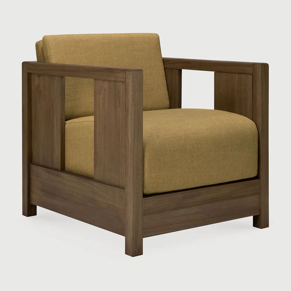The Roan lounge chair is based on a 1930s original by Paul Poiret, reinterpreted in a form that feels steady and composed. A solid wooden frame surrounds a generous seat, creating a compact chair with a grounded stance. Defined by clean lines and structured arms, Roan offers comfort without excess. Amethyst Home provides interior design, new home construction design consulting, vintage area rugs, and lighting in the Omaha metro area.
