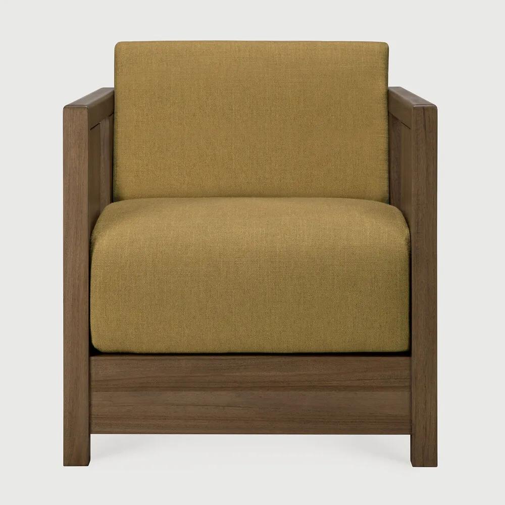 The Roan lounge chair is based on a 1930s original by Paul Poiret, reinterpreted in a form that feels steady and composed. A solid wooden frame surrounds a generous seat, creating a compact chair with a grounded stance. Defined by clean lines and structured arms, Roan offers comfort without excess. Amethyst Home provides interior design, new home construction design consulting, vintage area rugs, and lighting in the Portland metro area.