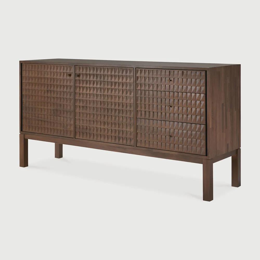 Sono, where antique-inspired craftsmanship meets modern elegance. This refined statement collection features hand-carved panels, offering functional storage behind classic beauty. Delicate casted brass handles elevate its look, making for a stunning addition to a room. Amethyst Home provides interior design, new home construction design consulting, vintage area rugs, and lighting in the Des Moines metro area.