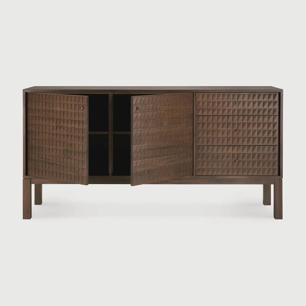 Sono, where antique-inspired craftsmanship meets modern elegance. This refined statement collection features hand-carved panels, offering functional storage behind classic beauty. Delicate casted brass handles elevate its look, making for a stunning addition to a room. Amethyst Home provides interior design, new home construction design consulting, vintage area rugs, and lighting in the Laguna Beach metro area.