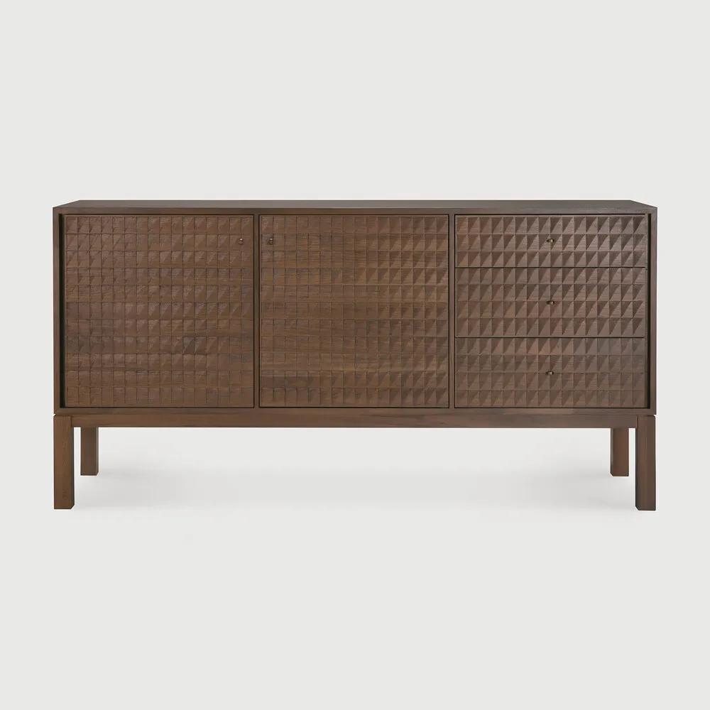 Sono, where antique-inspired craftsmanship meets modern elegance. This refined statement collection features hand-carved panels, offering functional storage behind classic beauty. Delicate casted brass handles elevate its look, making for a stunning addition to a room. Amethyst Home provides interior design, new home construction design consulting, vintage area rugs, and lighting in the Washington metro area.
