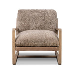 The perfect place to curl up with a good book. A hand-shaped parawood frame supports low, deep seating upholstered with taupe shearling Amethyst Home provides interior design, new home construction design consulting, vintage area rugs, and lighting in the Austin metro area.