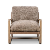 The perfect place to curl up with a good book. A hand-shaped parawood frame supports low, deep seating upholstered with taupe shearling Amethyst Home provides interior design, new home construction design consulting, vintage area rugs, and lighting in the Austin metro area.