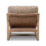 The perfect place to curl up with a good book. A hand-shaped parawood frame supports low, deep seating upholstered with taupe shearling Amethyst Home provides interior design, new home construction design consulting, vintage area rugs, and lighting in the Des Moines metro area.