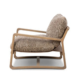 The perfect place to curl up with a good book. A hand-shaped parawood frame supports low, deep seating upholstered with taupe shearling Amethyst Home provides interior design, new home construction design consulting, vintage area rugs, and lighting in the Scottsdale metro area.