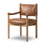 Featuring Adaline Sonoma Chestnut Dining Armchair by Four Hands at Amethyst Home. Elevate your dining space with a mixed-material seat inspired by Nordic minimalism. Plush cushioning upholstered in exclusive top-grain leather add volume, while a natural oak frame lightens the whole look. Overall Dimensions: 25.00"w x 23.50"d x 35.00"h. Amethyst Home provides interior design, new home construction design consulting, vintage area rugs, and lighting in the Charlotte metro area.