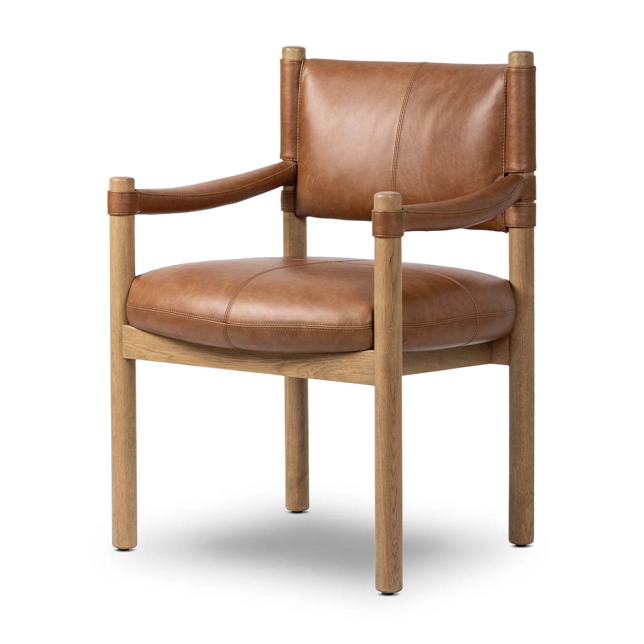 Featuring Adaline Sonoma Chestnut Dining Armchair by Four Hands at Amethyst Home. Elevate your dining space with a mixed-material seat inspired by Nordic minimalism. Plush cushioning upholstered in exclusive top-grain leather add volume, while a natural oak frame lightens the whole look. Overall Dimensions: 25.00"w x 23.50"d x 35.00"h. Amethyst Home provides interior design, new home construction design consulting, vintage area rugs, and lighting in the Charlotte metro area.