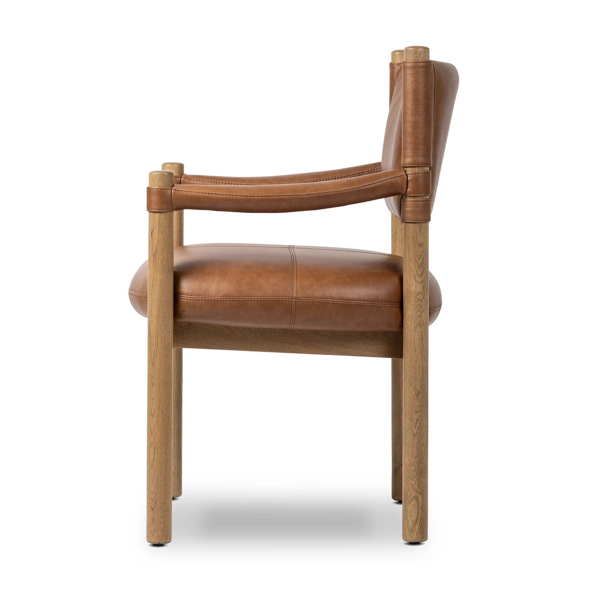 Featuring Adaline Sonoma Chestnut Dining Armchair by Four Hands at Amethyst Home. Elevate your dining space with a mixed-material seat inspired by Nordic minimalism. Plush cushioning upholstered in exclusive top-grain leather add volume, while a natural oak frame lightens the whole look. Overall Dimensions: 25.00"w x 23.50"d x 35.00"h. Amethyst Home provides interior design, new home construction design consulting, vintage area rugs, and lighting in the Park City metro area.