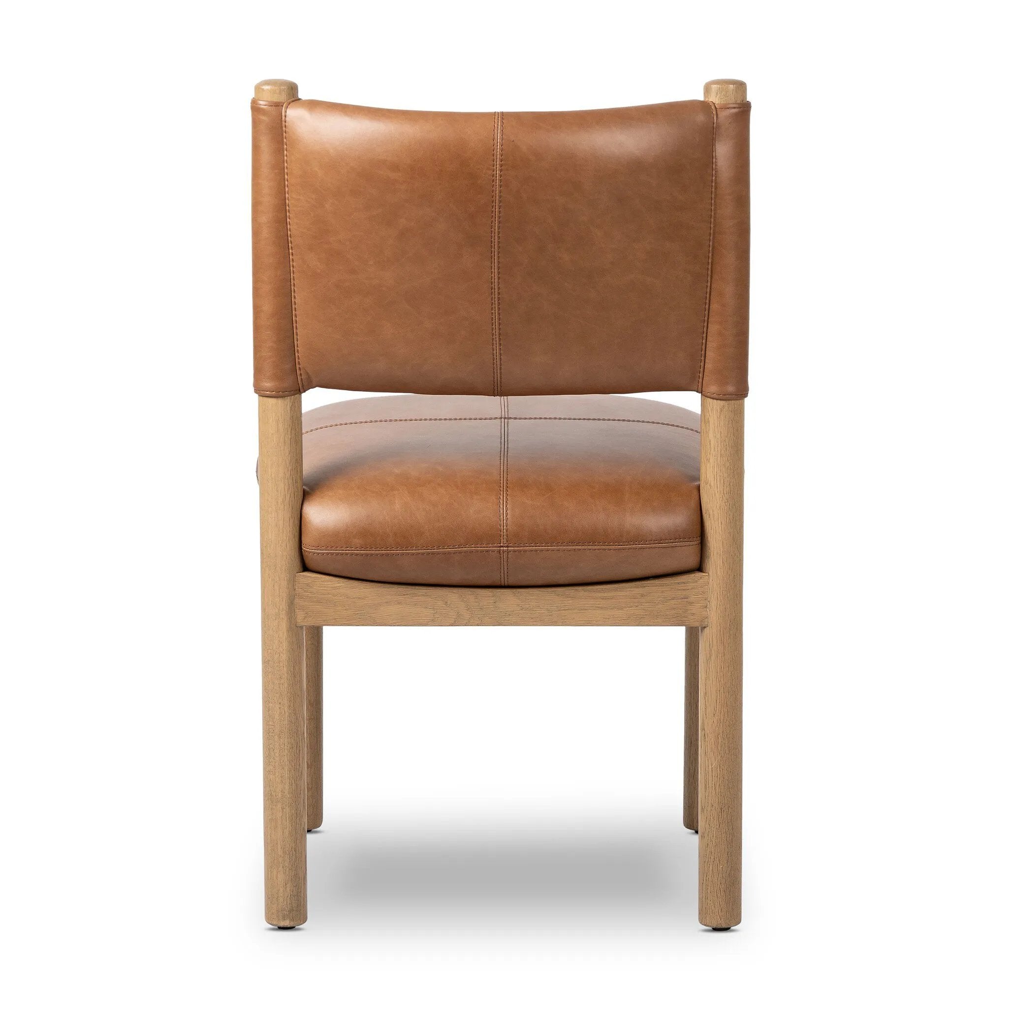 Featuring Adaline Sonoma Chestnut Dining Chair by Four Hands at Amethyst Home. Elevate your dining space with a mixed-material seat inspired by Nordic minimalism. Plush cushions of exclusive top-grain leather craft comfort and volume, all framed out by natural oak. Overall Dimensions: 21.00"w x 23.50"d x 35.00"h. Amethyst Home provides interior design, new home construction design consulting, vintage area rugs, and lighting in the Houston metro area.
