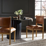 Featuring Adaline Sonoma Chestnut Dining Chair by Four Hands at Amethyst Home. Elevate your dining space with a mixed-material seat inspired by Nordic minimalism. Plush cushions of exclusive top-grain leather craft comfort and volume, all framed out by natural oak. Overall Dimensions: 21.00"w x 23.50"d x 35.00"h. Amethyst Home provides interior design, new home construction design consulting, vintage area rugs, and lighting in the San Diego metro area.