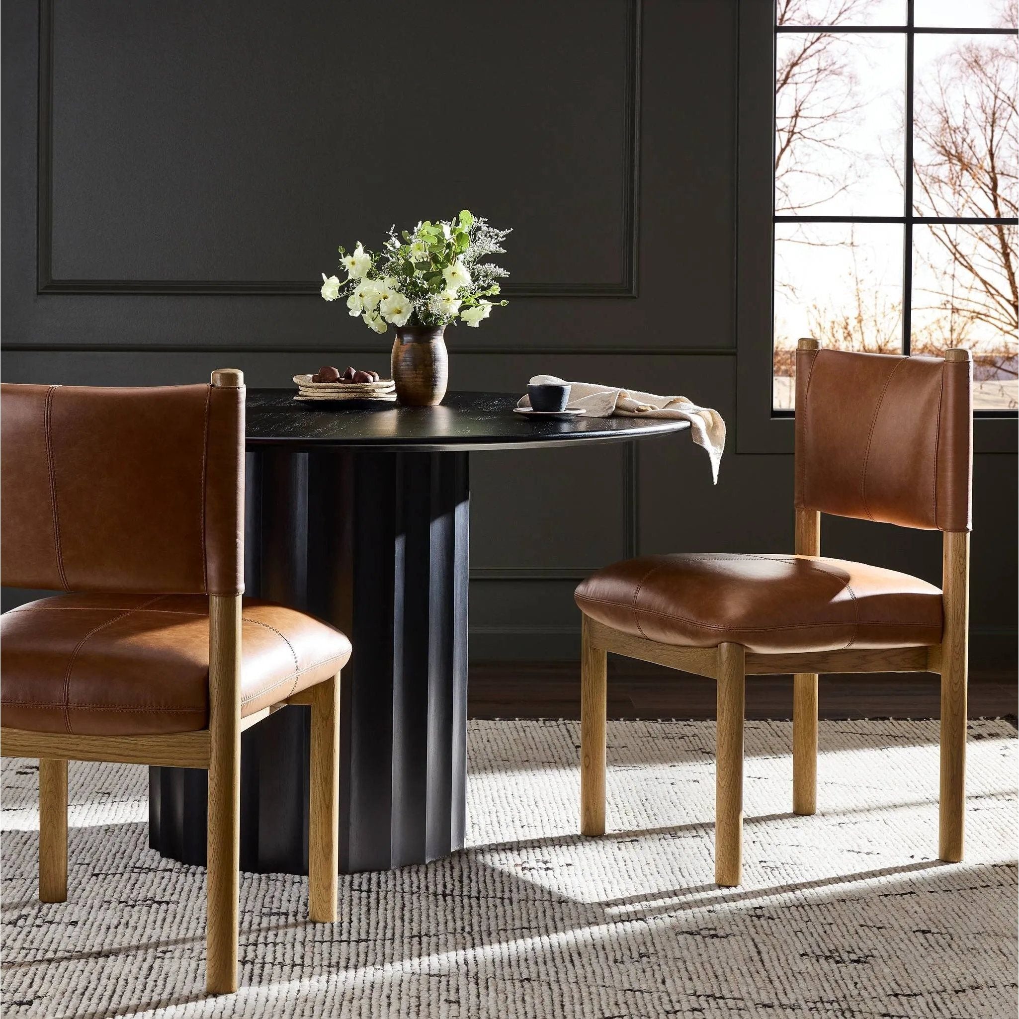 Featuring Adaline Sonoma Chestnut Dining Chair by Four Hands at Amethyst Home. Elevate your dining space with a mixed-material seat inspired by Nordic minimalism. Plush cushions of exclusive top-grain leather craft comfort and volume, all framed out by natural oak. Overall Dimensions: 21.00"w x 23.50"d x 35.00"h. Amethyst Home provides interior design, new home construction design consulting, vintage area rugs, and lighting in the San Diego metro area.