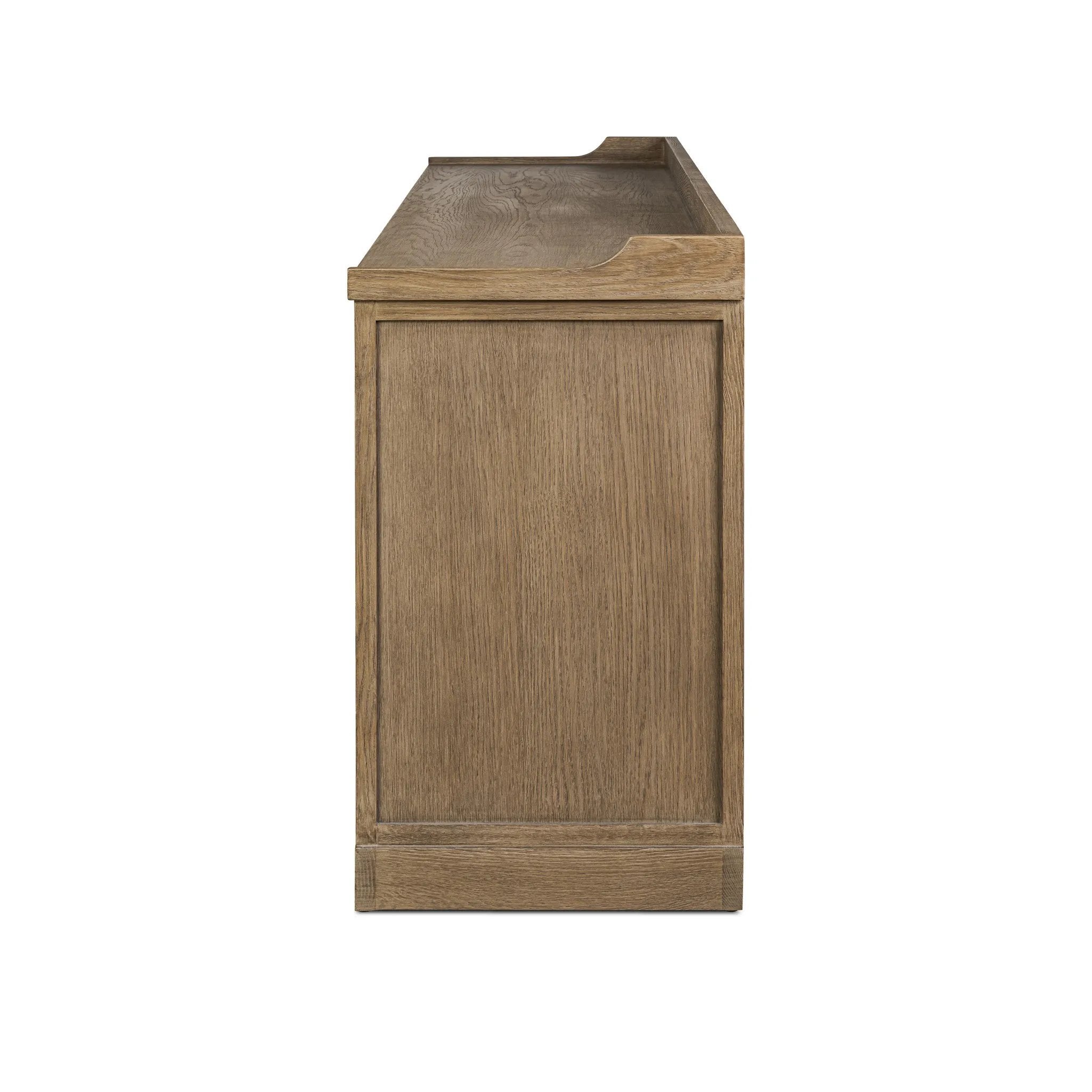 The classic sideboard takes new shape with a unique gallery design on top. Doors are fixed with a functional lock. Aged bronze hardware complements a weathered washed oak finish Amethyst Home provides interior design, new home construction design consulting, vintage area rugs, and lighting in the Austin metro area.