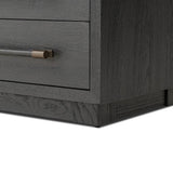 Beautifully minimalist. A three-drawer dresser made from black-finished ash  features long, linear bronzed hardware for a smooth, clean look Amethyst Home provides interior design, new home construction design consulting, vintage area rugs, and lighting in the Austin metro area.