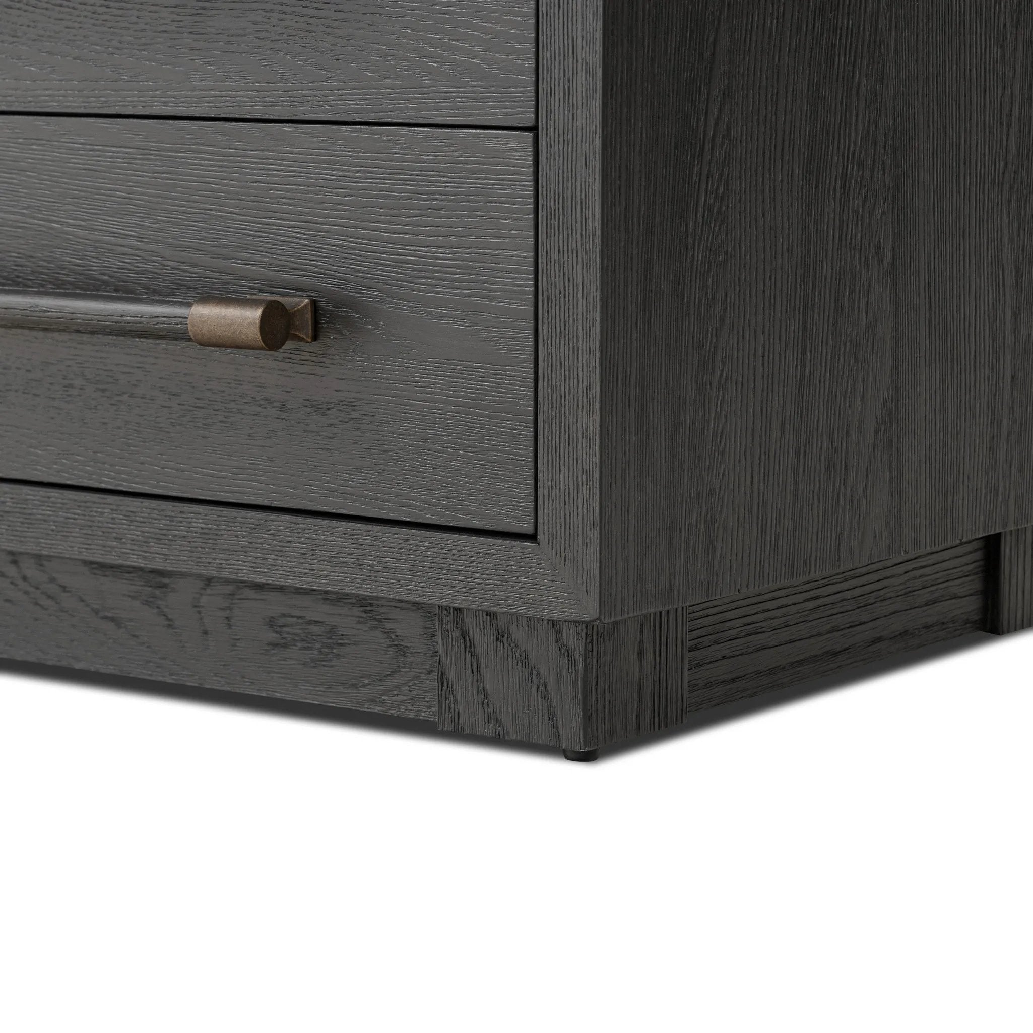 Beautifully minimalist. A three-drawer dresser made from black-finished ash  features long, linear bronzed hardware for a smooth, clean look Amethyst Home provides interior design, new home construction design consulting, vintage area rugs, and lighting in the Austin metro area.