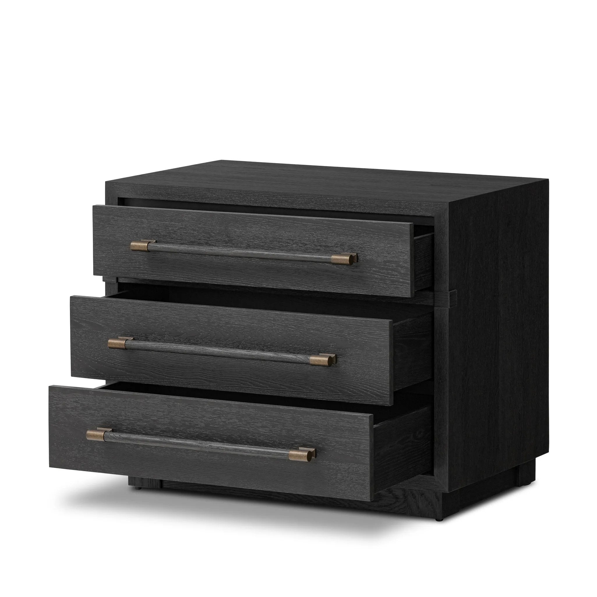 Beautifully minimalist. A three-drawer dresser made from black-finished ash  features long, linear bronzed hardware for a smooth, clean look Amethyst Home provides interior design, new home construction design consulting, vintage area rugs, and lighting in the Calabasas metro area.