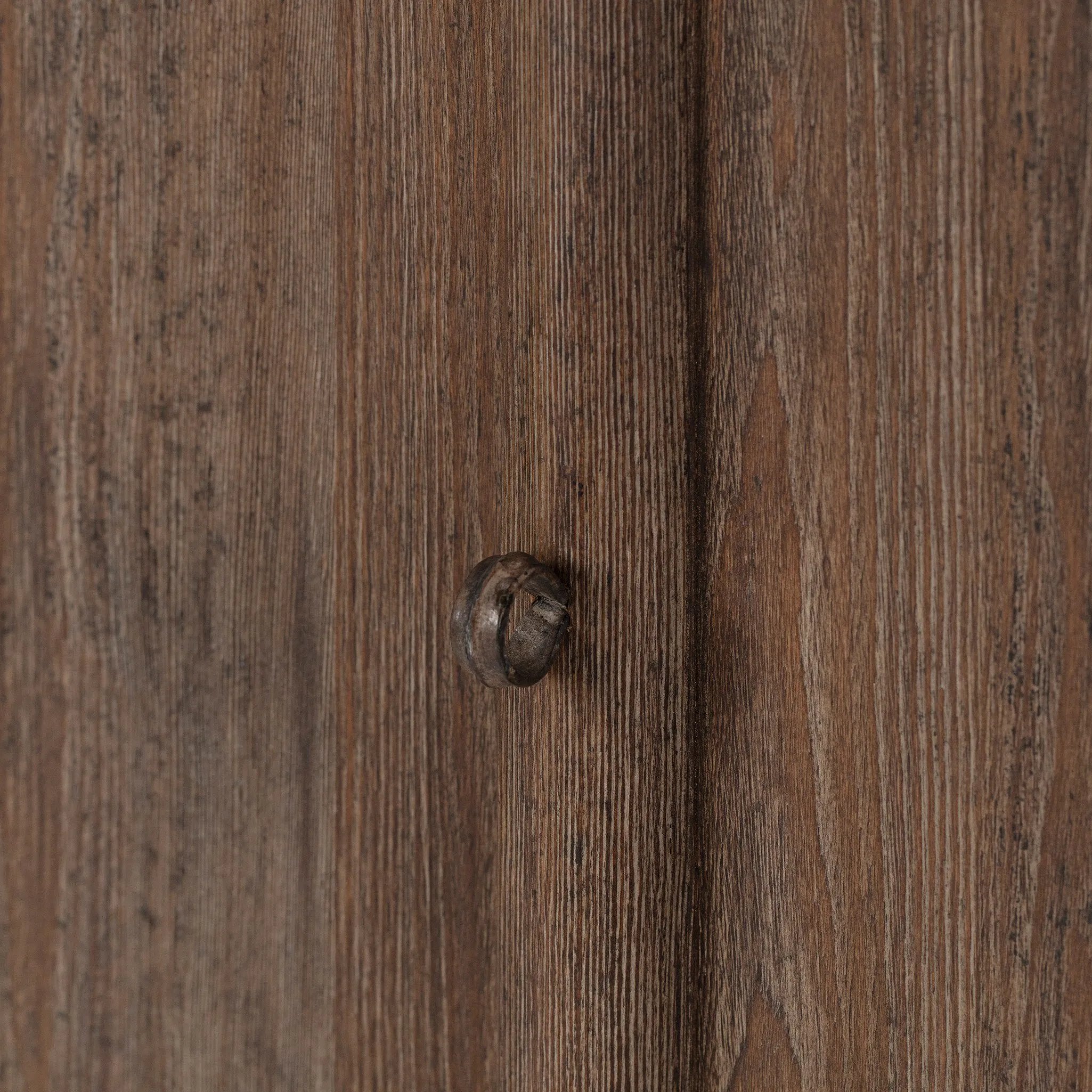 Taking after an antique from China, this inspired cabinet features overlapping double doors and rounded accents. Crafted from solid pine and veneers in a distressed finish for a rustic look Amethyst Home provides interior design, new home construction design consulting, vintage area rugs, and lighting in the San Diego metro area.