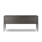 Baroque-period detailing gives this oak desk its  classic look. Made from worn black oak with metal ring pulls on its four drawers, as well as cabriole-like legs to soften the lines Amethyst Home provides interior design, new home construction design consulting, vintage area rugs, and lighting in the Boston metro area.