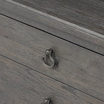 Baroque-period detailing gives this oak desk its  classic look. Made from worn black oak with metal ring pulls on its four drawers, as well as cabriole-like legs to soften the lines Amethyst Home provides interior design, new home construction design consulting, vintage area rugs, and lighting in the Calabasas metro area.