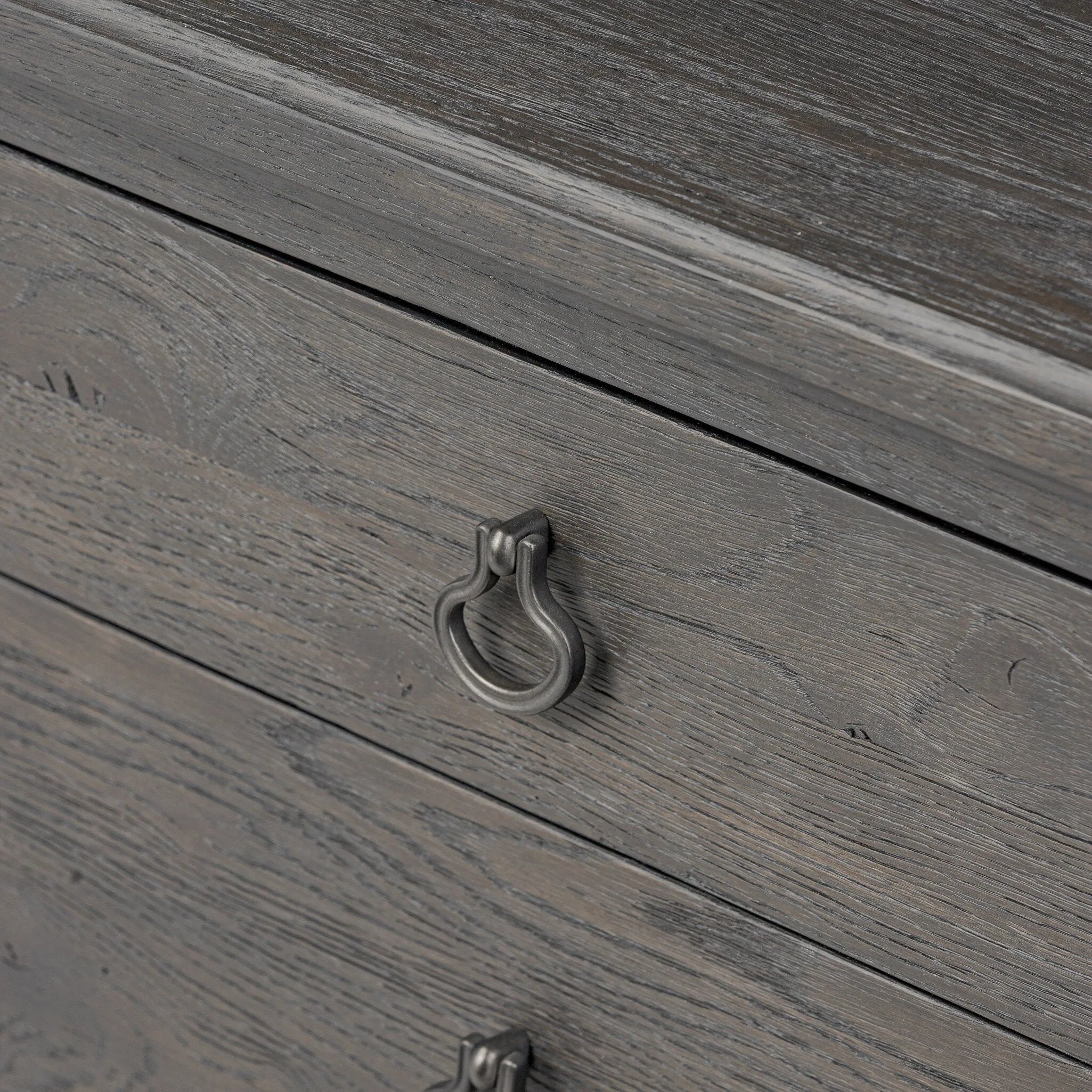 Baroque-period detailing gives this oak desk its  classic look. Made from worn black oak with metal ring pulls on its four drawers, as well as cabriole-like legs to soften the lines Amethyst Home provides interior design, new home construction design consulting, vintage area rugs, and lighting in the Calabasas metro area.
