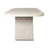 This outdoor dining table features a double pedestal silhouette that's defined by striking contrast between a smooth, refined top and heavily textured legs for a look that's straight from the quarry. It comes together with a water transfer technique on concrete that mimics natural marble. Amethyst Home provides interior design, new home construction design consulting, vintage area rugs, and lighting in the San Diego metro area.