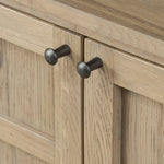 An aged finish plays up oak's natural wood grain, while grid-like patterned doors bring dimension to clean lines. Interior shelving awaits storage of serveware, table linens and more Amethyst Home provides interior design, new home construction design consulting, vintage area rugs, and lighting in the Austin metro area.