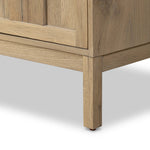 An aged finish plays up oak's natural wood grain, while grid-like patterned doors bring dimension to clean lines. Interior shelving awaits storage of serveware, table linens and more Amethyst Home provides interior design, new home construction design consulting, vintage area rugs, and lighting in the Laguna Beach metro area.
