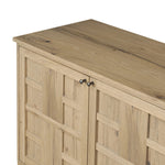 An aged finish plays up oak's natural wood grain, while grid-like patterned doors bring dimension to clean lines. Interior shelving awaits storage of serveware, table linens and more Amethyst Home provides interior design, new home construction design consulting, vintage area rugs, and lighting in the Los Angeles metro area.