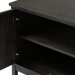 A transitional piece that works into your collection with ease. This solid oak sideboard is finished in a smoked black, highlighting natural graining inherent to rich character woods. Grid-like patterned doors bring dimension to clean, simple shaping, while interior shelving awaits storage of dinnerware, table linens and more. Amethyst Home provides interior design, new home construction design consulting, vintage area rugs, and lighting in the Winter Garden metro area.