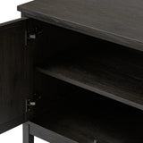 A transitional piece that works into your collection with ease. This solid oak sideboard is finished in a smoked black, highlighting natural graining inherent to rich character woods. Grid-like patterned doors bring dimension to clean, simple shaping, while interior shelving awaits storage of dinnerware, table linens and more. Amethyst Home provides interior design, new home construction design consulting, vintage area rugs, and lighting in the Winter Garden metro area.
