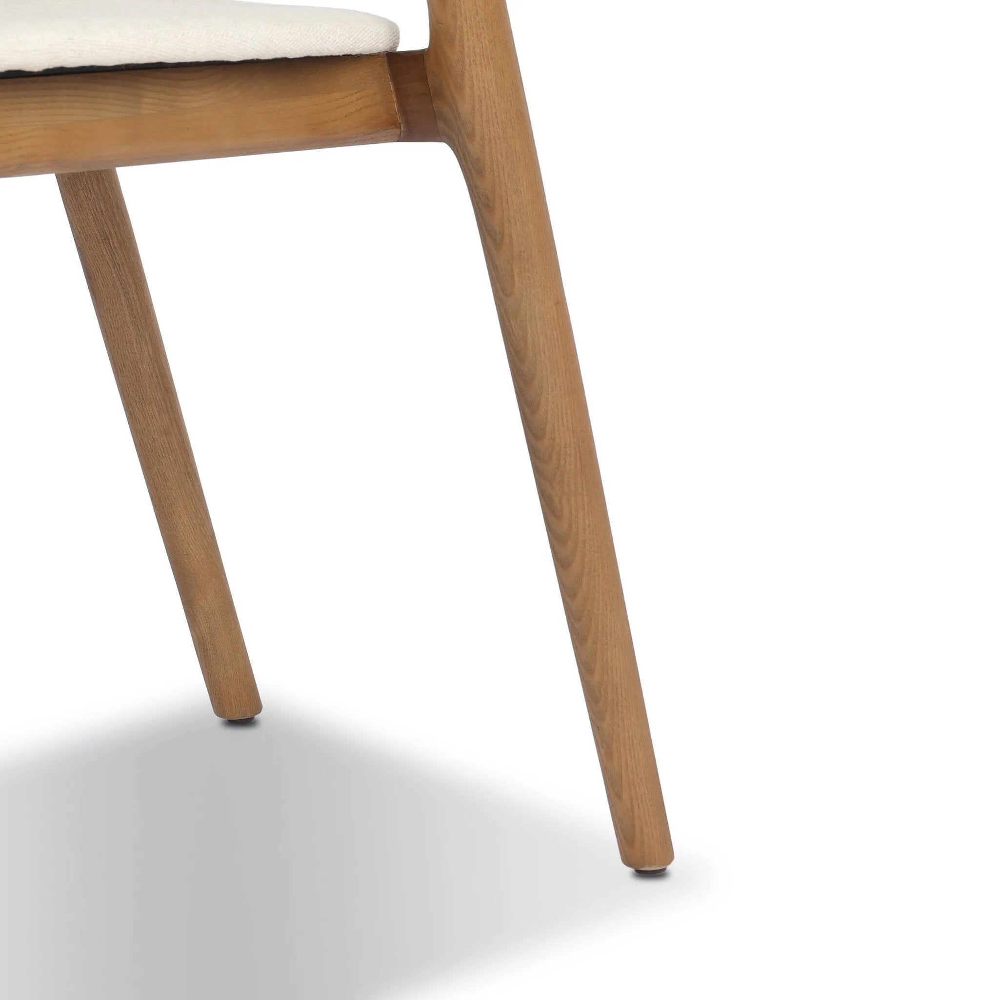 Inspired by clean, simple Scandinavian styling, solid ash forms a shapely, open frame for tan top-grain leather seating in a monochromatic tone Amethyst Home provides interior design, new home construction design consulting, vintage area rugs, and lighting in the Charlotte metro area.
