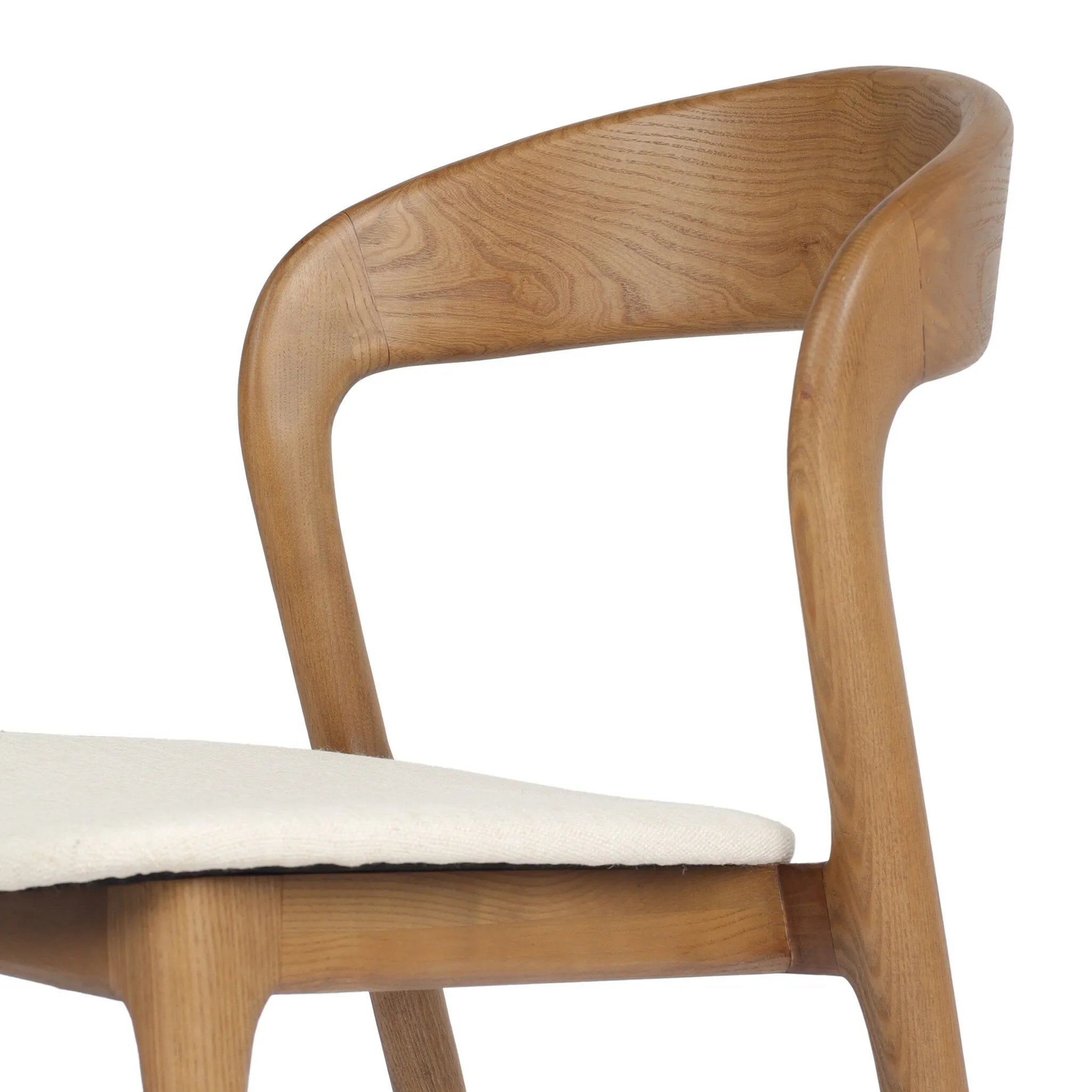 Inspired by clean, simple Scandinavian styling, solid ash forms a shapely, open frame for tan top-grain leather seating in a monochromatic tone Amethyst Home provides interior design, new home construction design consulting, vintage area rugs, and lighting in the Des Moines metro area.