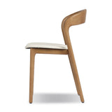 Inspired by clean, simple Scandinavian styling, solid ash forms a shapely, open frame for tan top-grain leather seating in a monochromatic tone Amethyst Home provides interior design, new home construction design consulting, vintage area rugs, and lighting in the Miami metro area.