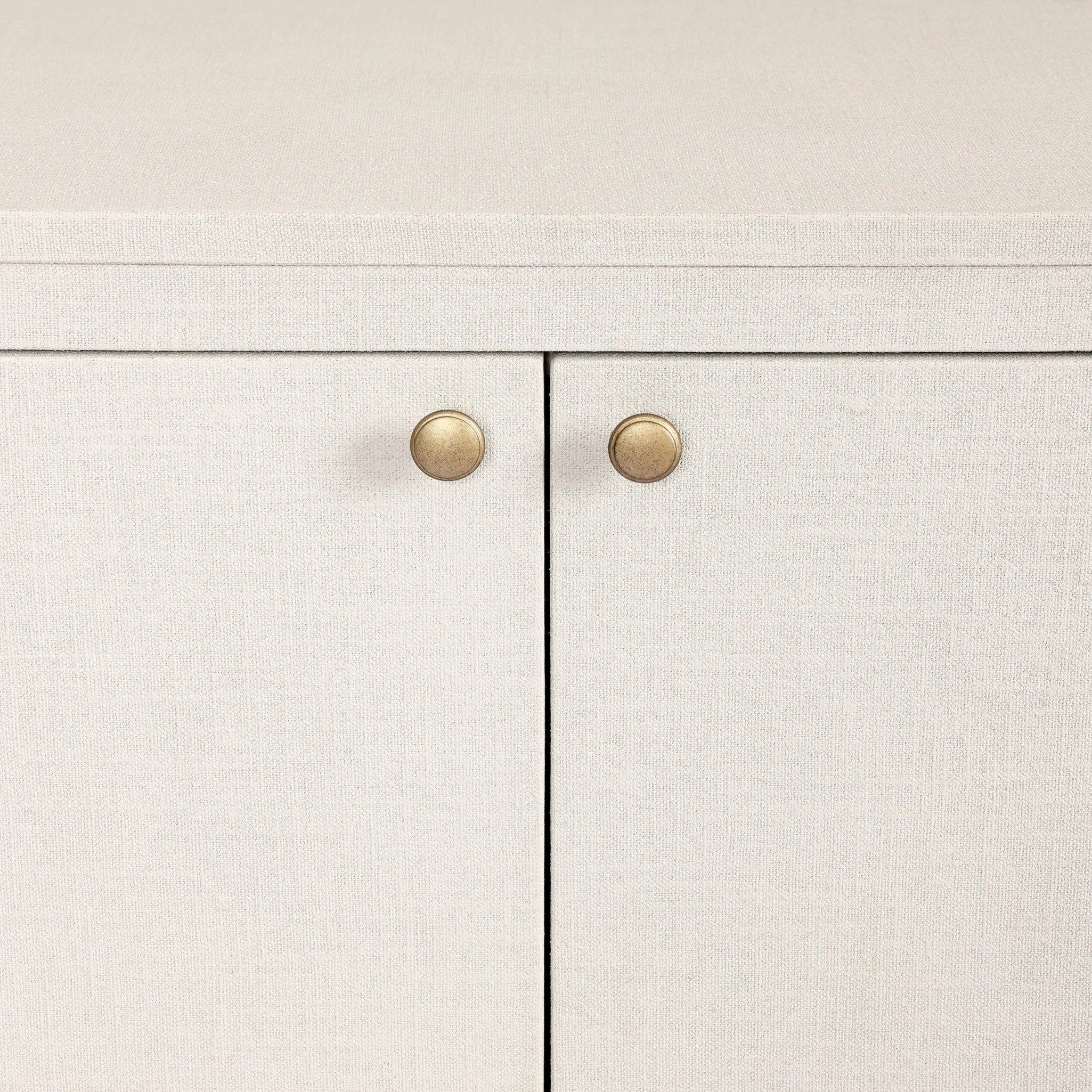 Uniquely made from ivory-painted linen, a beautifully curved sideboard gives shape to generous storage for dinnerware, linens and more Amethyst Home provides interior design, new home construction design consulting, vintage area rugs, and lighting in the Charlotte metro area.