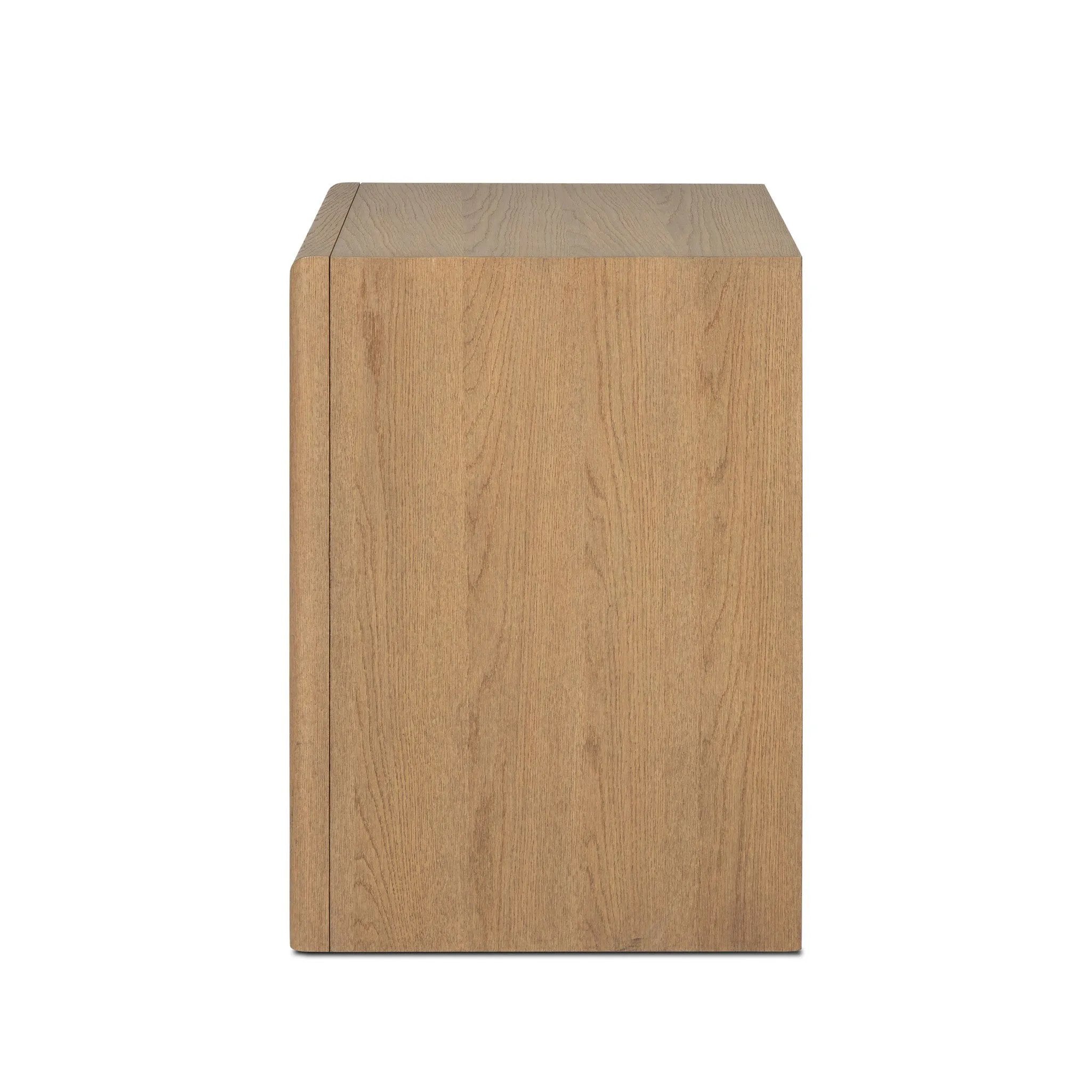 Crafted from sandy solid oak in a waterfall silhouette, this nightstand adds a touch of contemporary simplicity to the bedside. Stack your favorite books on a spacious bottom shelf. The piece’s bullnose edge and oval iron drawer pull add variety. Amethyst Home provides interior design, new home construction design consulting, vintage area rugs, and lighting in the Boston metro area.