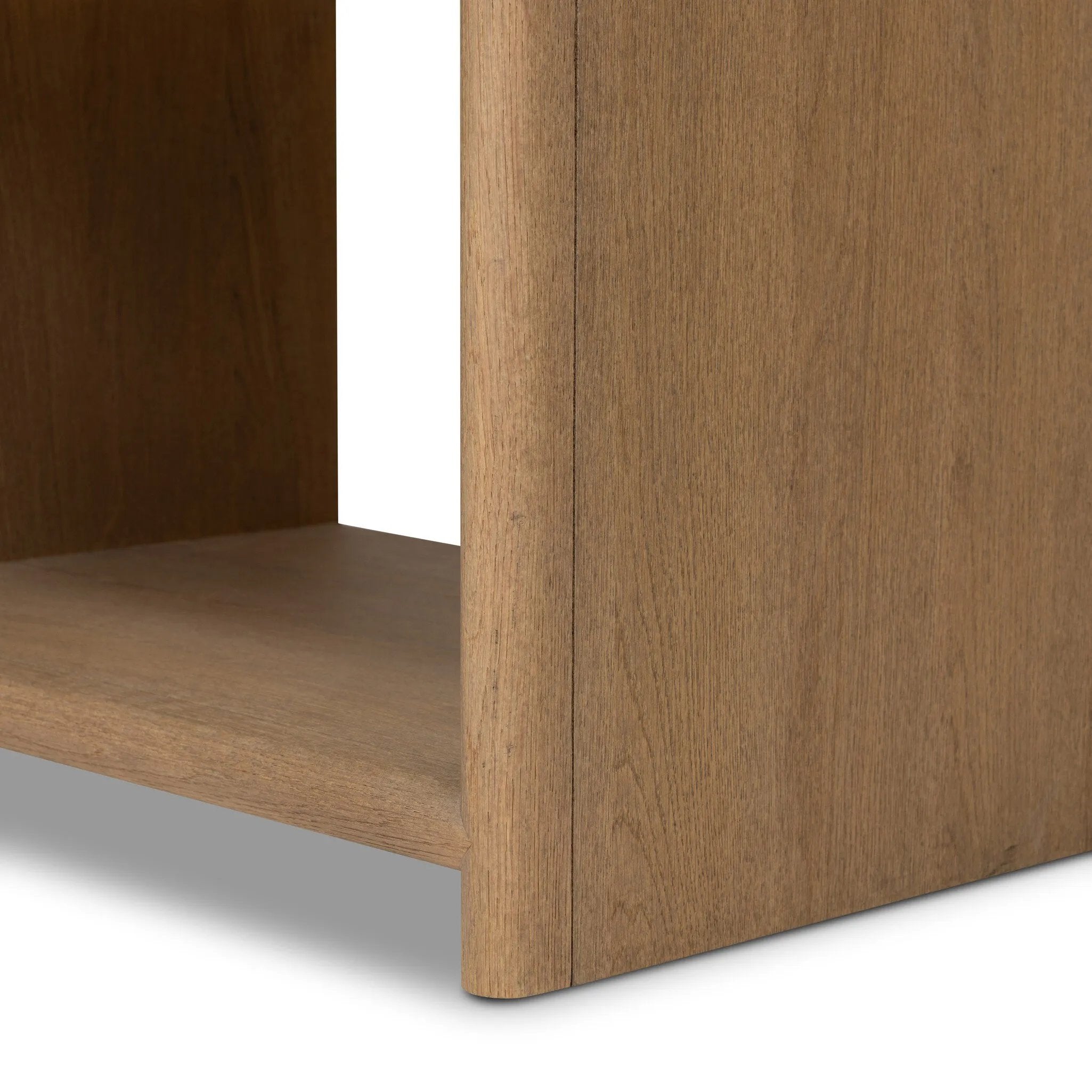 Crafted from sandy solid oak in a waterfall silhouette, this nightstand adds a touch of contemporary simplicity to the bedside. Stack your favorite books on a spacious bottom shelf. The piece’s bullnose edge and oval iron drawer pull add variety. Amethyst Home provides interior design, new home construction design consulting, vintage area rugs, and lighting in the Houston metro area.