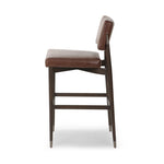 Featuring Anton Havana Brown  Bar + Counter Stool by Four Hands at Amethyst Home. Eighties inspiration gone modern. With iron-dipped caps, tapered legs of solid oak frame this counter stool's seat and back, upholstered in brown top-grain leather. Slim wood stretchers add an airy vibe.BarOverall Dimensions: 20.00"w x 23.75"d x 42.75"hWeight: 18.08 lbsCounterOve. Amethyst Home provides interior design, new home construction design consulting, vintage area rugs, and lighting in the Austin metro area.