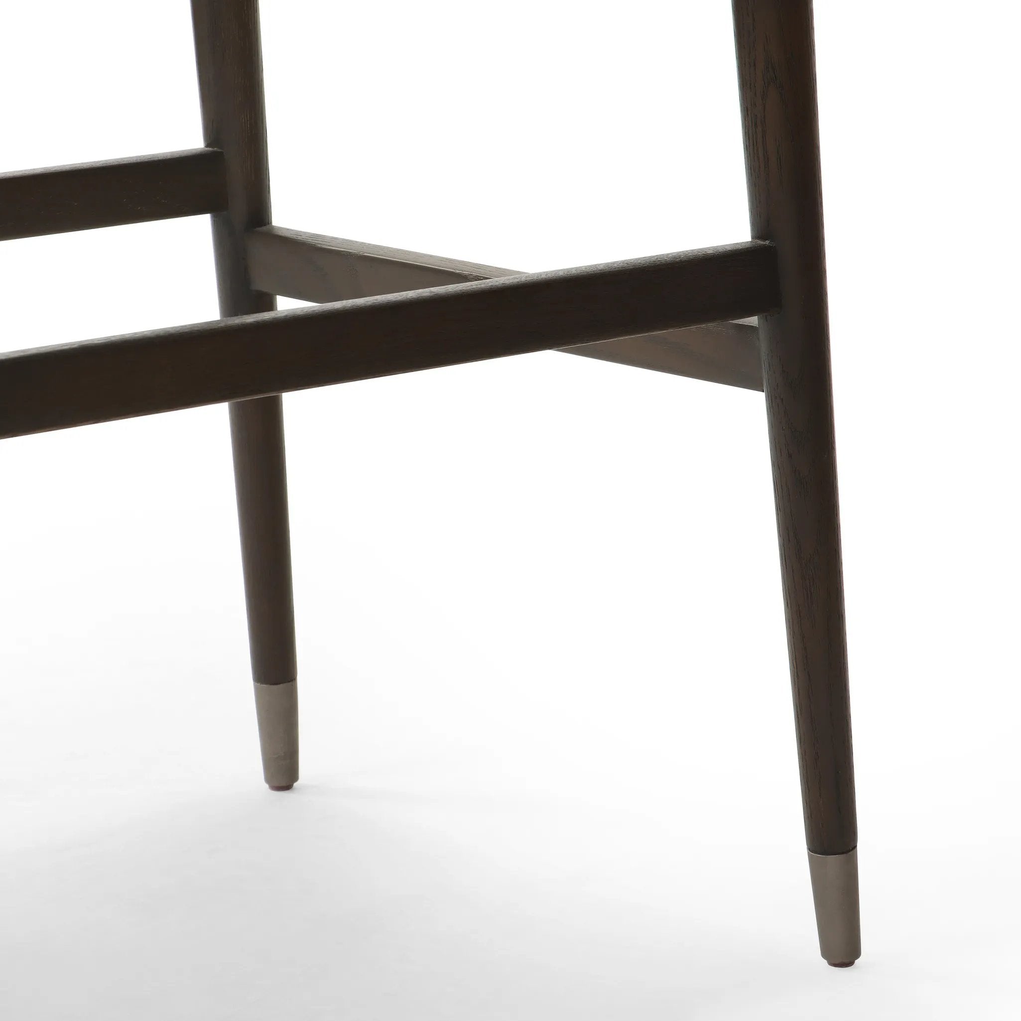 Featuring Anton Havana Brown  Bar + Counter Stool by Four Hands at Amethyst Home. Eighties inspiration gone modern. With iron-dipped caps, tapered legs of solid oak frame this counter stool's seat and back, upholstered in brown top-grain leather. Slim wood stretchers add an airy vibe.BarOverall Dimensions: 20.00"w x 23.75"d x 42.75"hWeight: 18.08 lbsCounterOve. Amethyst Home provides interior design, new home construction design consulting, vintage area rugs, and lighting in the Boston metro area.