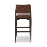 Featuring Anton Havana Brown  Bar + Counter Stool by Four Hands at Amethyst Home. Eighties inspiration gone modern. With iron-dipped caps, tapered legs of solid oak frame this counter stool's seat and back, upholstered in brown top-grain leather. Slim wood stretchers add an airy vibe.BarOverall Dimensions: 20.00"w x 23.75"d x 42.75"hWeight: 18.08 lbsCounter. Amethyst Home provides interior design, new home construction design consulting, vintage area rugs, and lighting in the Calabasas metro area.