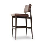 Featuring Anton Havana Brown  Bar + Counter Stool by Four Hands at Amethyst Home. Eighties inspiration gone modern. With iron-dipped caps, tapered legs of solid oak frame this counter stool's seat and back, upholstered in brown top-grain leather. Slim wood stretchers add an airy vibe.BarOverall Dimensions: 20.00"w x 23.75"d x 42.75"hWeight: 18.08 lbsCo. Amethyst Home provides interior design, new home construction design consulting, vintage area rugs, and lighting in the Salt Lake City metro area.