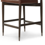 Featuring Anton Havana Brown  Bar + Counter Stool by Four Hands at Amethyst Home. Eighties inspiration gone modern. With iron-dipped caps, tapered legs of solid oak frame this counter stool's seat and back, upholstered in brown top-grain leather. Slim wood stretchers add an airy vibe.BarOverall Dimensions: 20.00"w x 23.75"d x 42.75"hWeight: 18.08 lbsCounter. Amethyst Home provides interior design, new home construction design consulting, vintage area rugs, and lighting in the San Diego metro area.