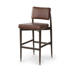 Featuring Anton Havana Brown  Bar + Counter Stool by Four Hands at Amethyst Home. Eighties inspiration gone modern. With iron-dipped caps, tapered legs of solid oak frame this counter stool's seat and back, upholstered in brown top-grain leather. Slim wood stretchers add an airy vibe.BarOverall Dimensions: 20.00"w x 23.75"d x 42.75"hWeight: 18.08 lbsCounte. Amethyst Home provides interior design, new home construction design consulting, vintage area rugs, and lighting in the Scottsdale metro area.