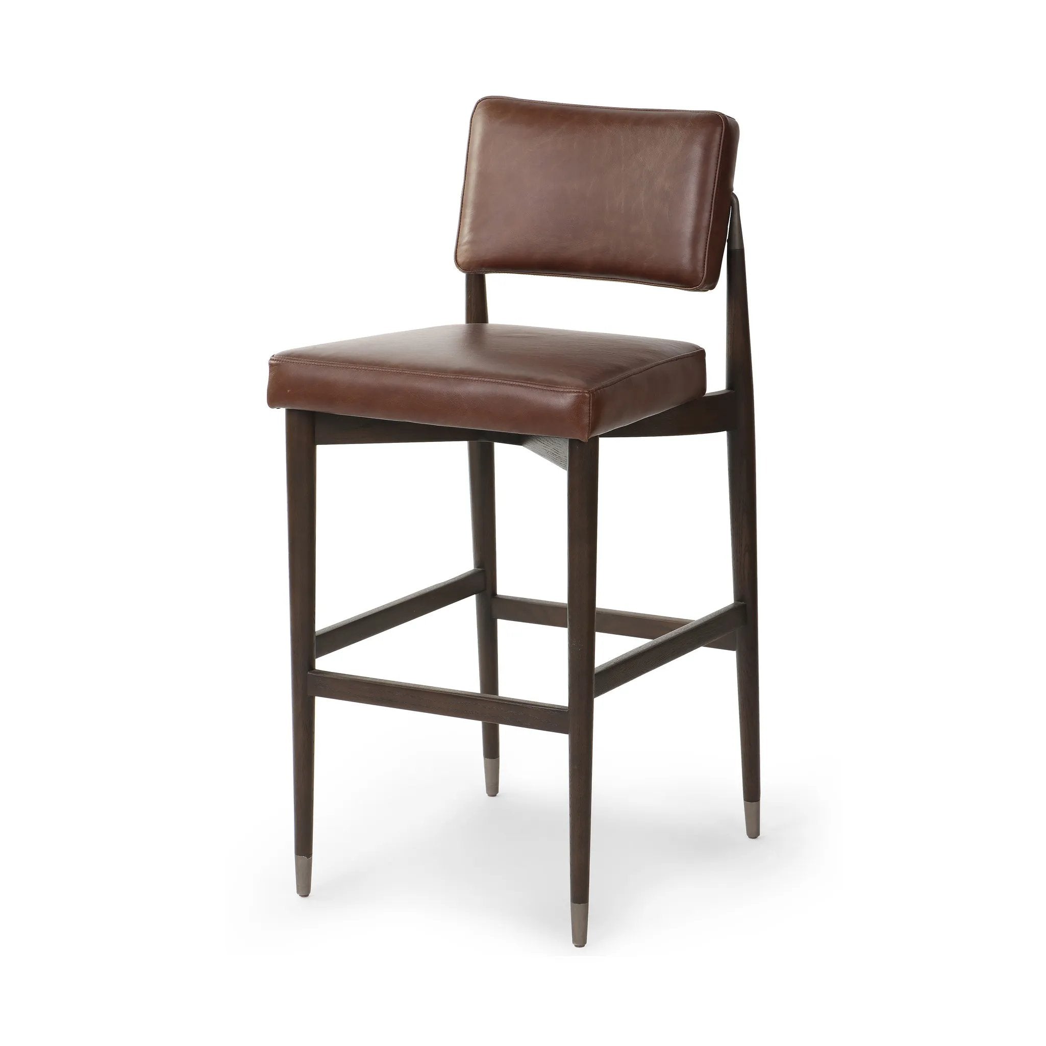 Featuring Anton Havana Brown  Bar + Counter Stool by Four Hands at Amethyst Home. Eighties inspiration gone modern. With iron-dipped caps, tapered legs of solid oak frame this counter stool's seat and back, upholstered in brown top-grain leather. Slim wood stretchers add an airy vibe.BarOverall Dimensions: 20.00"w x 23.75"d x 42.75"hWeight: 18.08 lbsCounte. Amethyst Home provides interior design, new home construction design consulting, vintage area rugs, and lighting in the Scottsdale metro area.