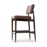 Featuring Anton Havana Brown  Bar + Counter Stool by Four Hands at Amethyst Home. Eighties inspiration gone modern. With iron-dipped caps, tapered legs of solid oak frame this counter stool's seat and back, upholstered in brown top-grain leather. Slim wood stretchers add an airy vibe.BarOverall Dimensions: 20.00"w x 23.75"d x 42.75"hWeight: 18.08 lbsCounte. Amethyst Home provides interior design, new home construction design consulting, vintage area rugs, and lighting in the Washington metro area.