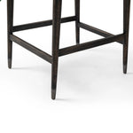 Featuring Anton Savile Flax Bar + Counter Stool by Four Hands at Amethyst Home. Eighties inspiration gone modern. With iron-dipped caps, tapered legs of solid oak frame this bar stool's seat and back, upholstered in light performance fabric. Slim wood stretchers add an airy vibe to this counter stool. Performance fabrics are specially created to withstand spill. Amethyst Home provides interior design, new home construction design consulting, vintage area rugs, and lighting in the Omaha metro area.