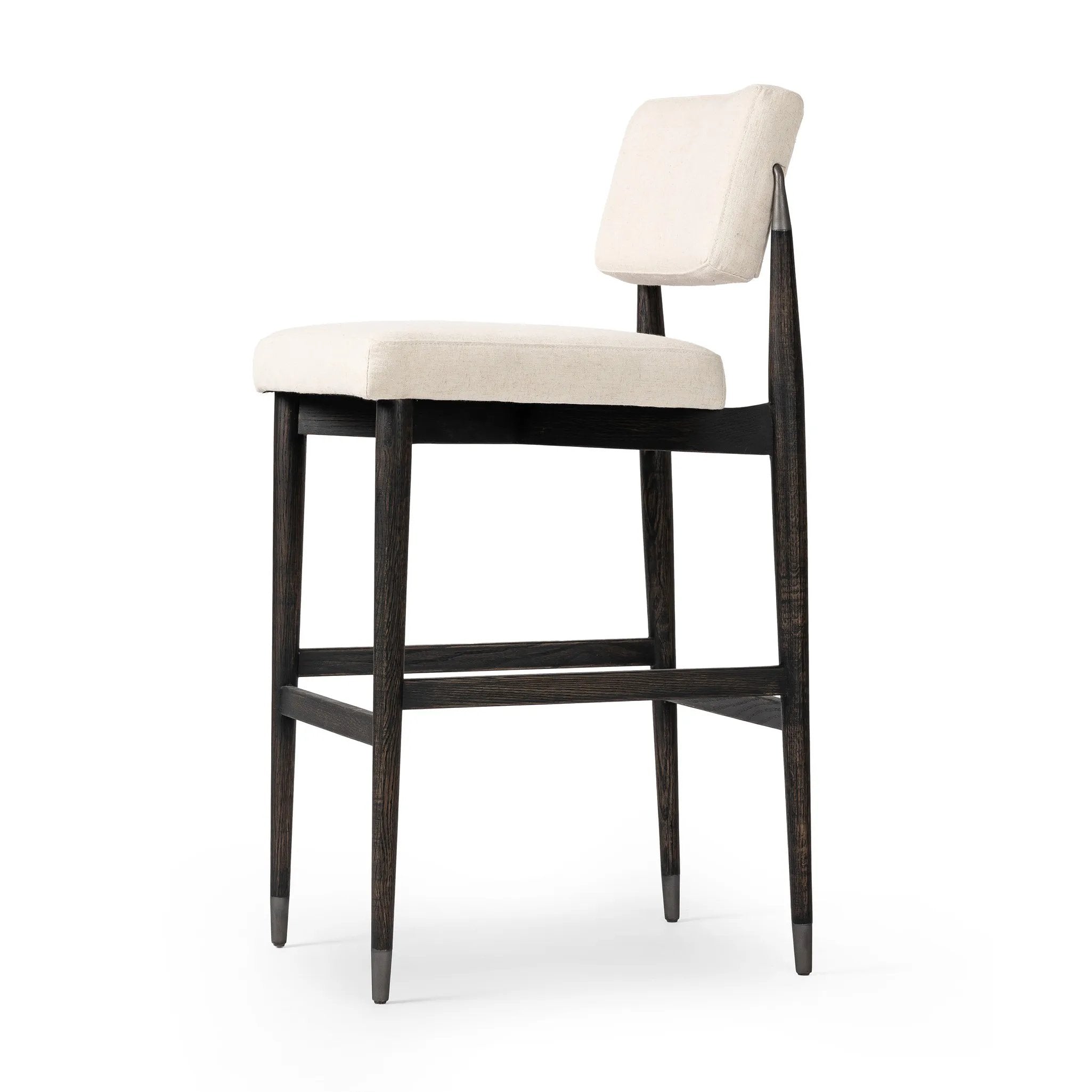 Featuring Anton Savile Flax Bar + Counter Stool by Four Hands at Amethyst Home. Eighties inspiration gone modern. With iron-dipped caps, tapered legs of solid oak frame this bar stool's seat and back, upholstered in light performance fabric. Slim wood stretchers add an airy vibe to this counter stool. Performance fabrics are specially created to withst. Amethyst Home provides interior design, new home construction design consulting, vintage area rugs, and lighting in the Salt Lake City metro area.
